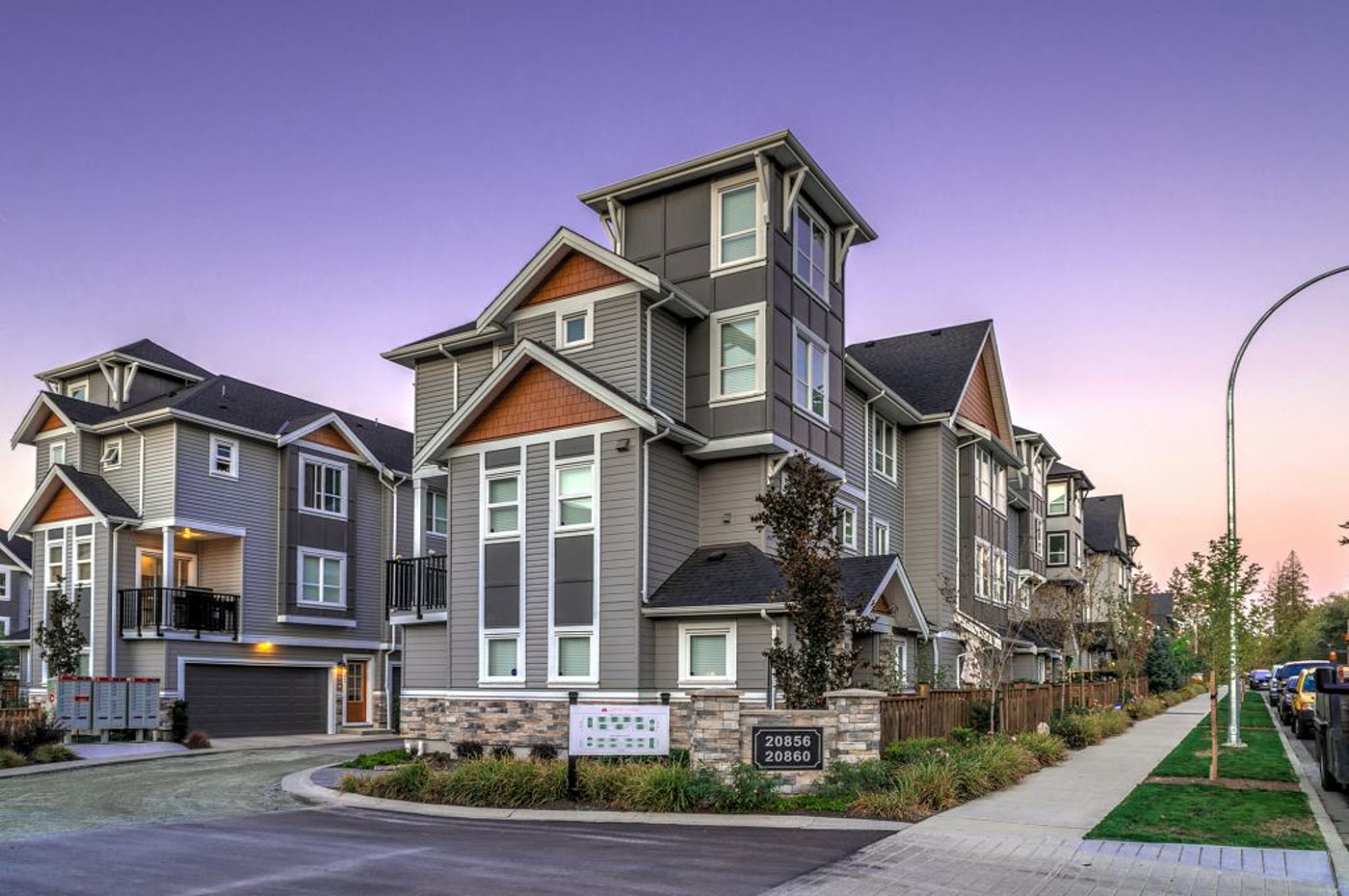 Lotus Living — a craftsman townhome community by Square Mile at dusk