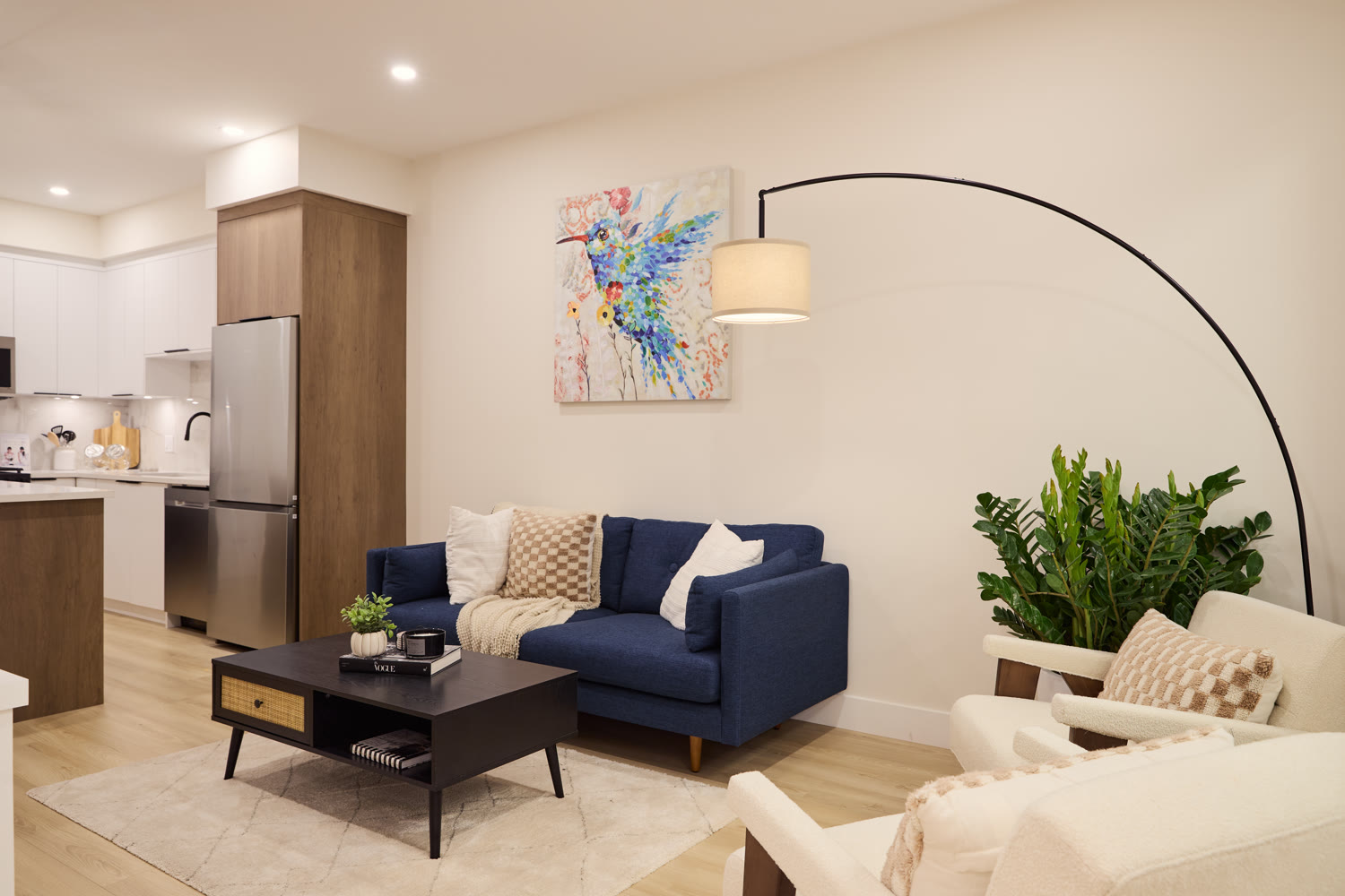 A finished living space at Zenith — warm oak, soft textiles, and natural light
