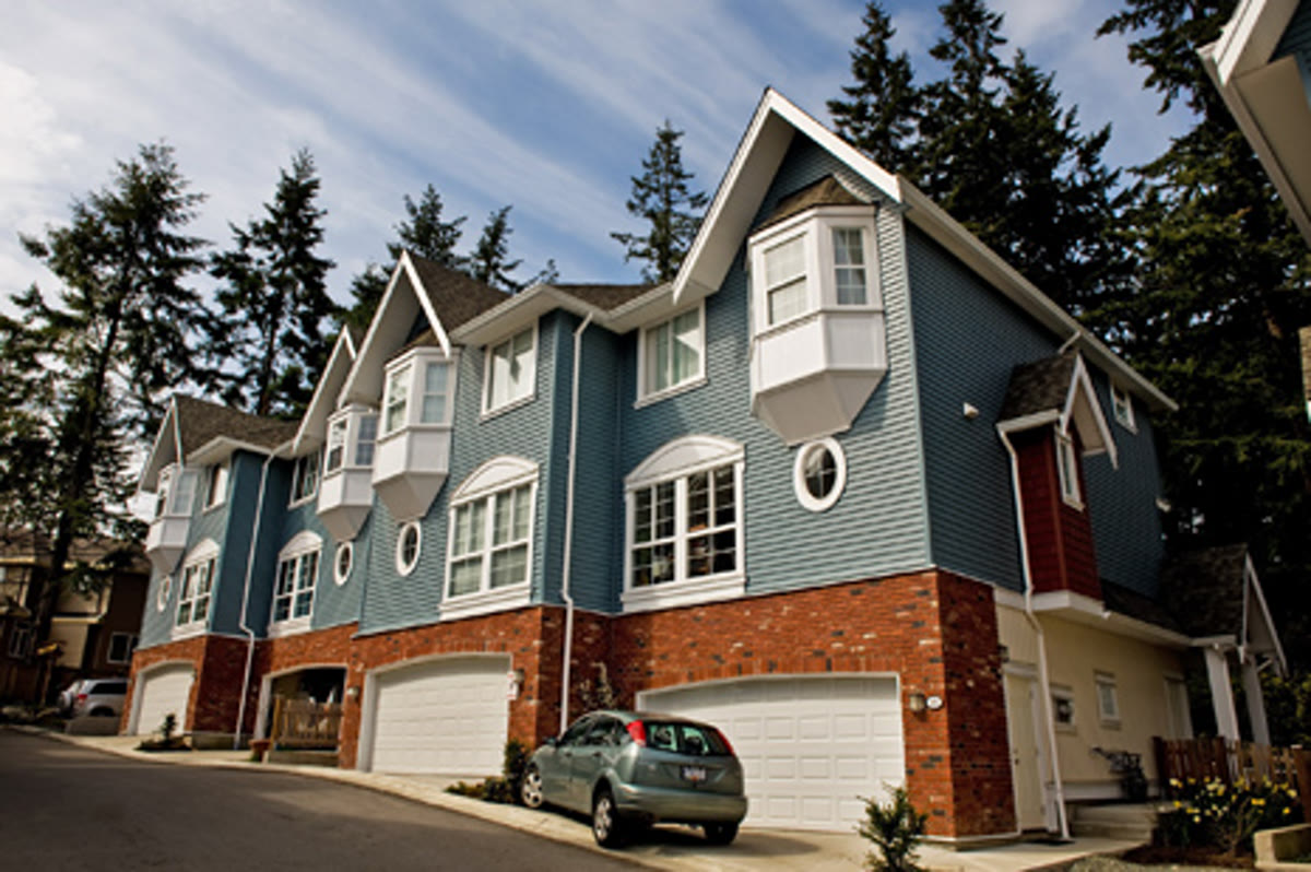 Evo — craftsman townhomes with brick detailing by Square Mile