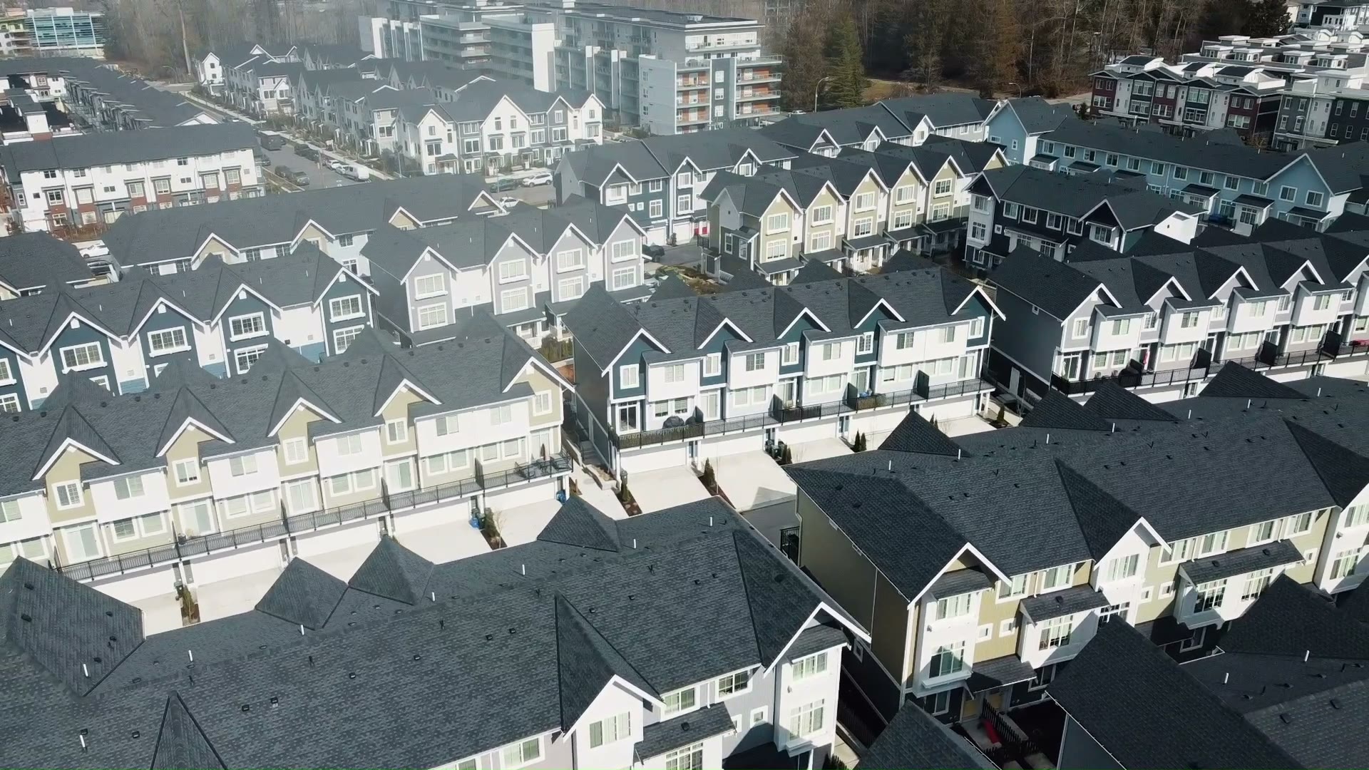 Aerial view of a multifamily and townhome community built by Square Mile Development